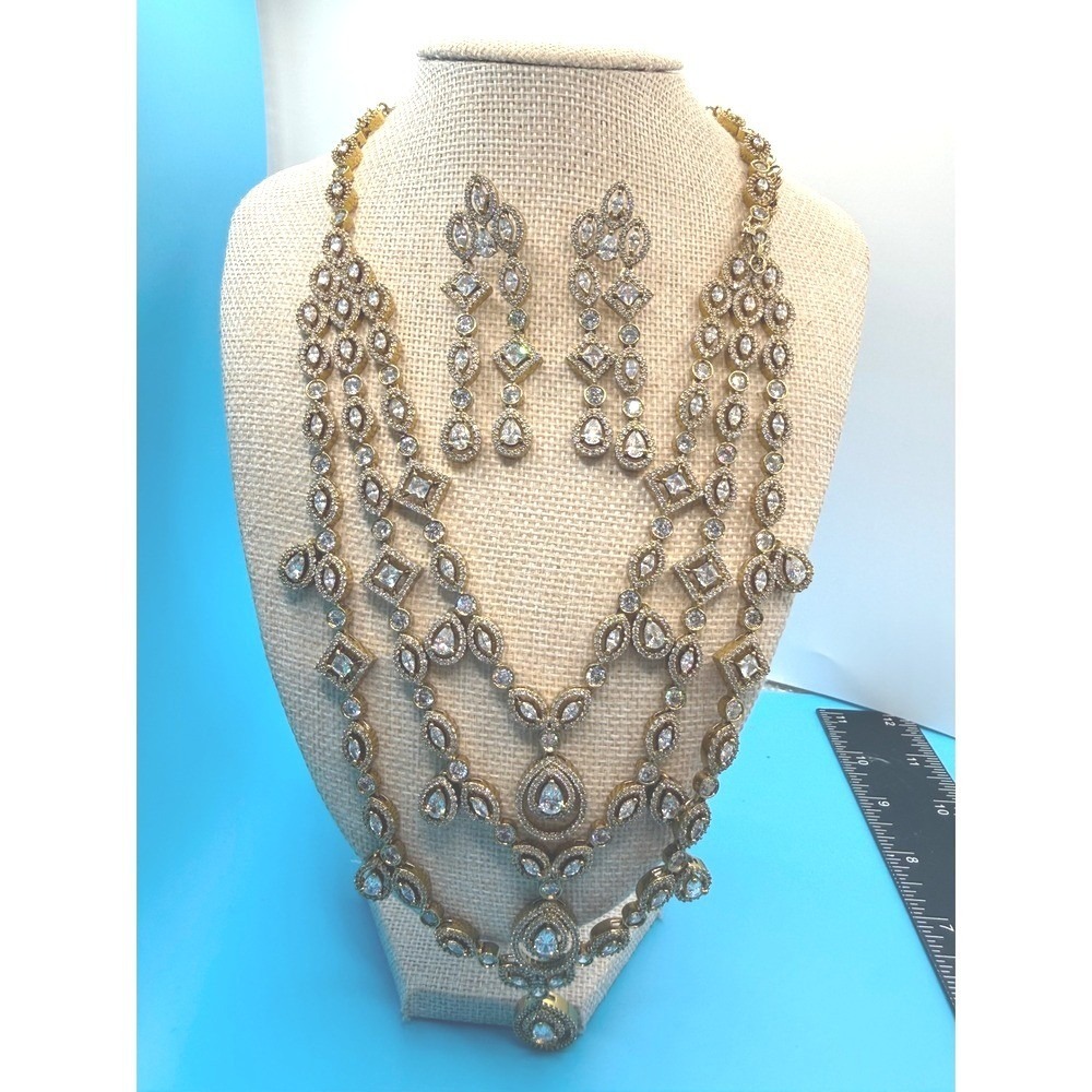 Gold Tone Crystal Multi Strand Statement Necklace and Dangle Earring Jewelry Set